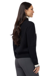 Angled back view of a model wearing Black Kerrits Reflections Full Zip Sweater on a white background