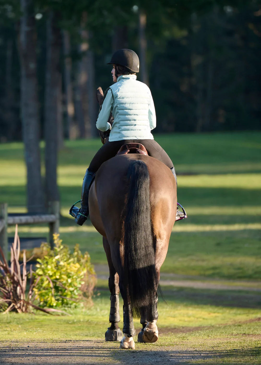 Back view of a model wearing Shoreline Kerrits All Trek Performance Quilted Vest