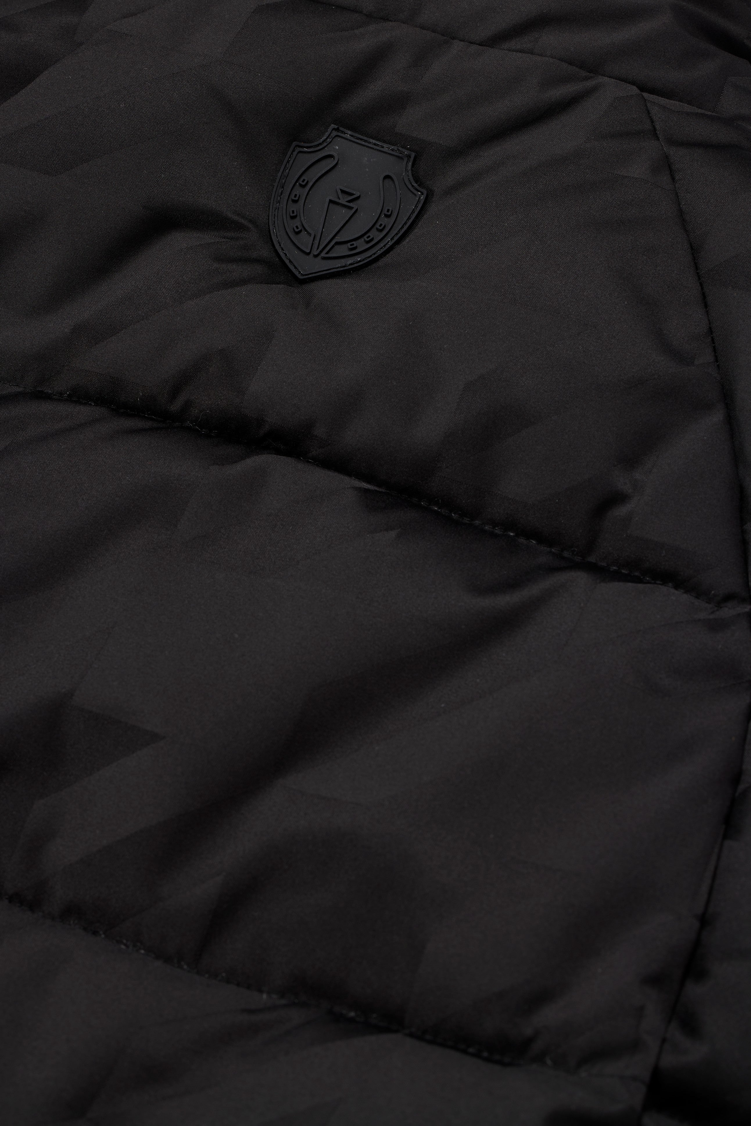 Closeup view of Black Kerrits Skyline Houndstooth Reversible Vest