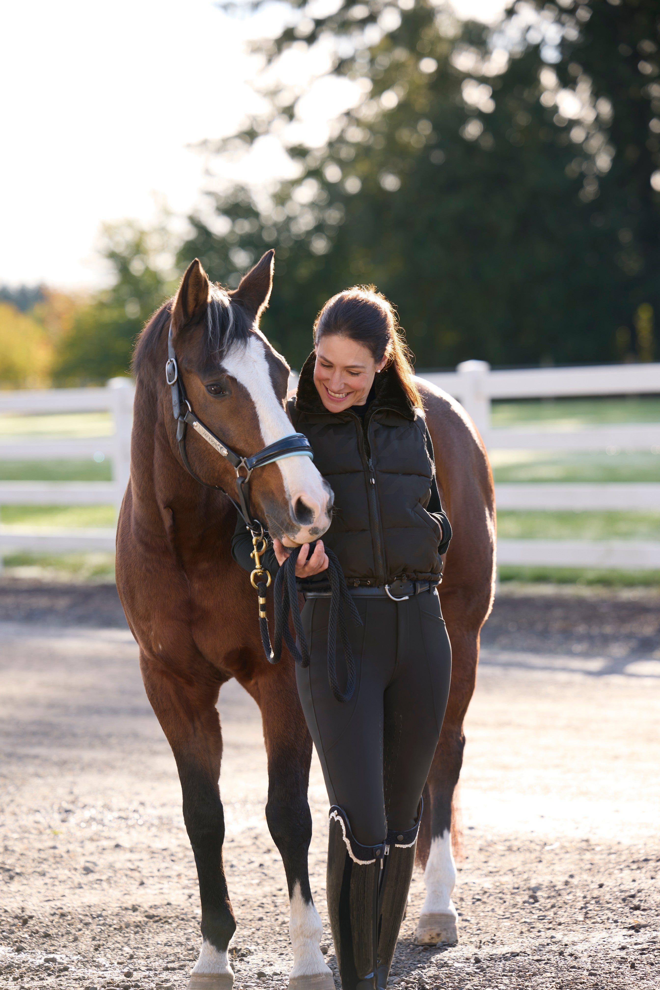 Front view of a model wearing Black Kerrits Skyline Houndstooth Reversible Vest