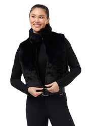 Front view of a model wearing Nightfall Kerrits Skyline Houndstooth Reversible Vest showing the reverse side on a white background