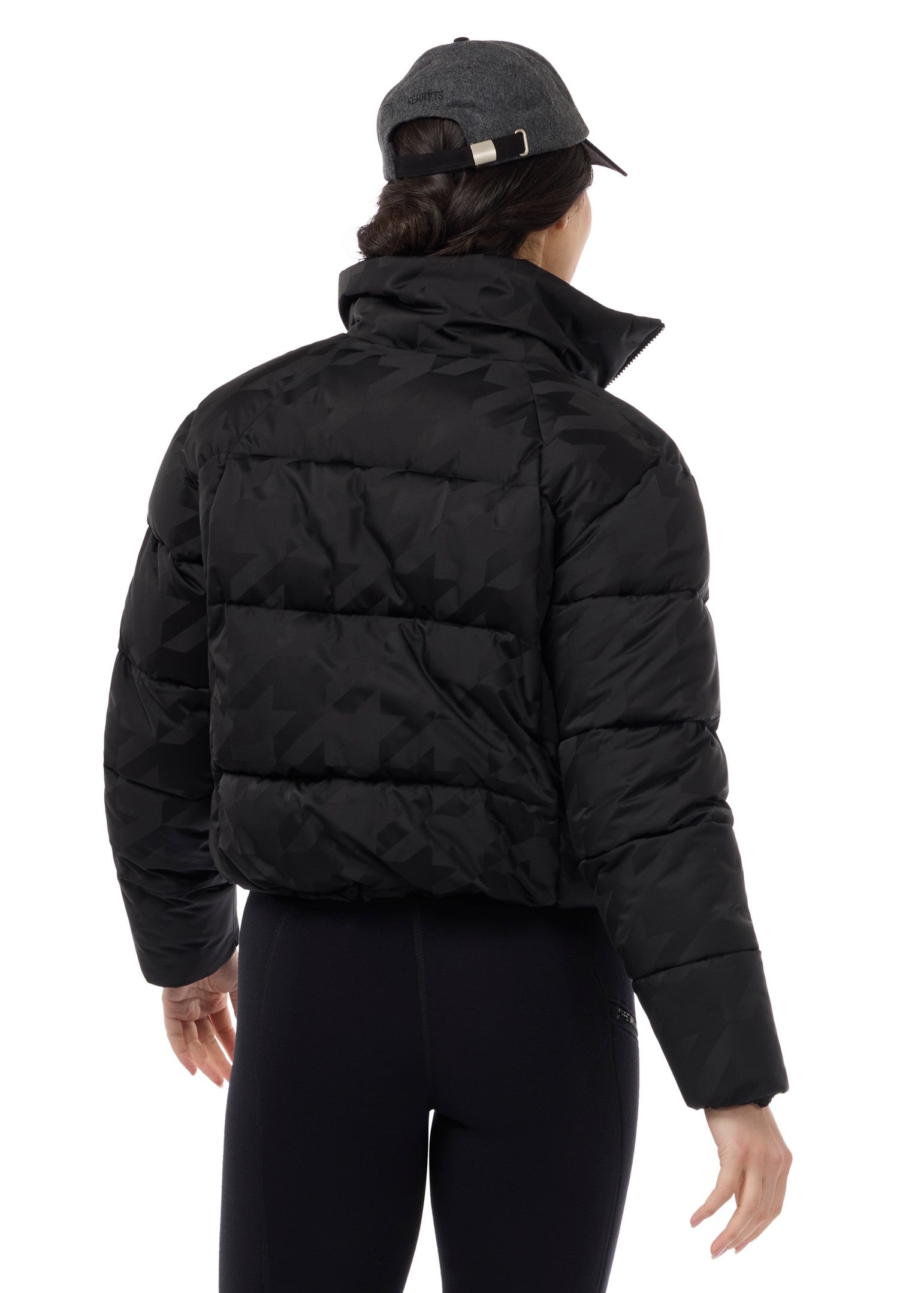 Back view of Black Kerrits Skyline Houndstooth Puffer Jacket on a white background