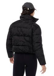 Back view of Black Kerrits Skyline Houndstooth Puffer Jacket on a white background