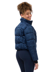 Angled back view of a model wearing Nightfall Kerrits Skyline Houndstooth Puffer Jacket