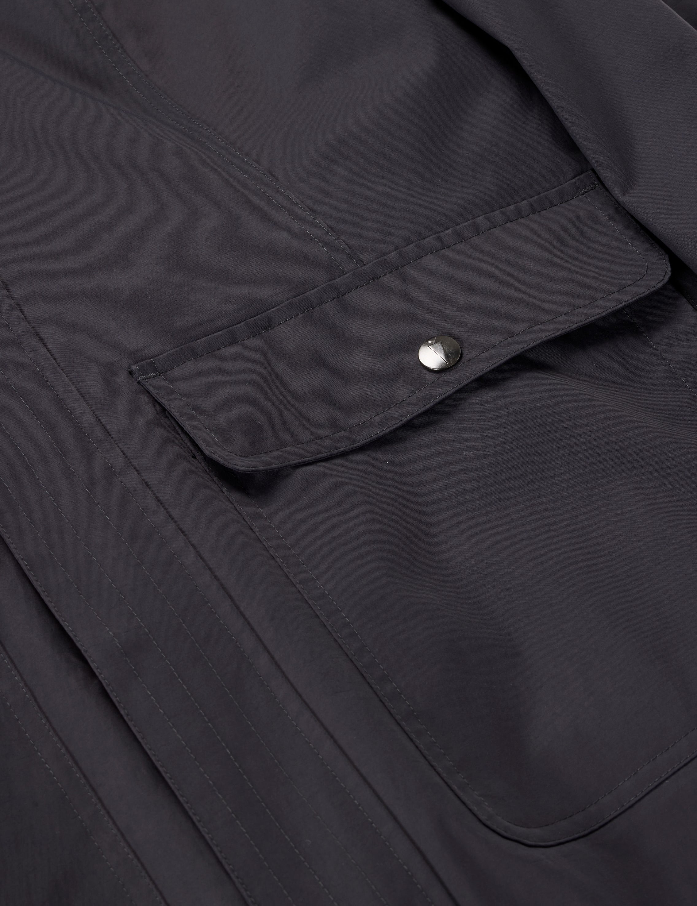 Closeup view of Carbon Kerrits Weatherlock Three-Quarter Length Jacket showing pocket detail