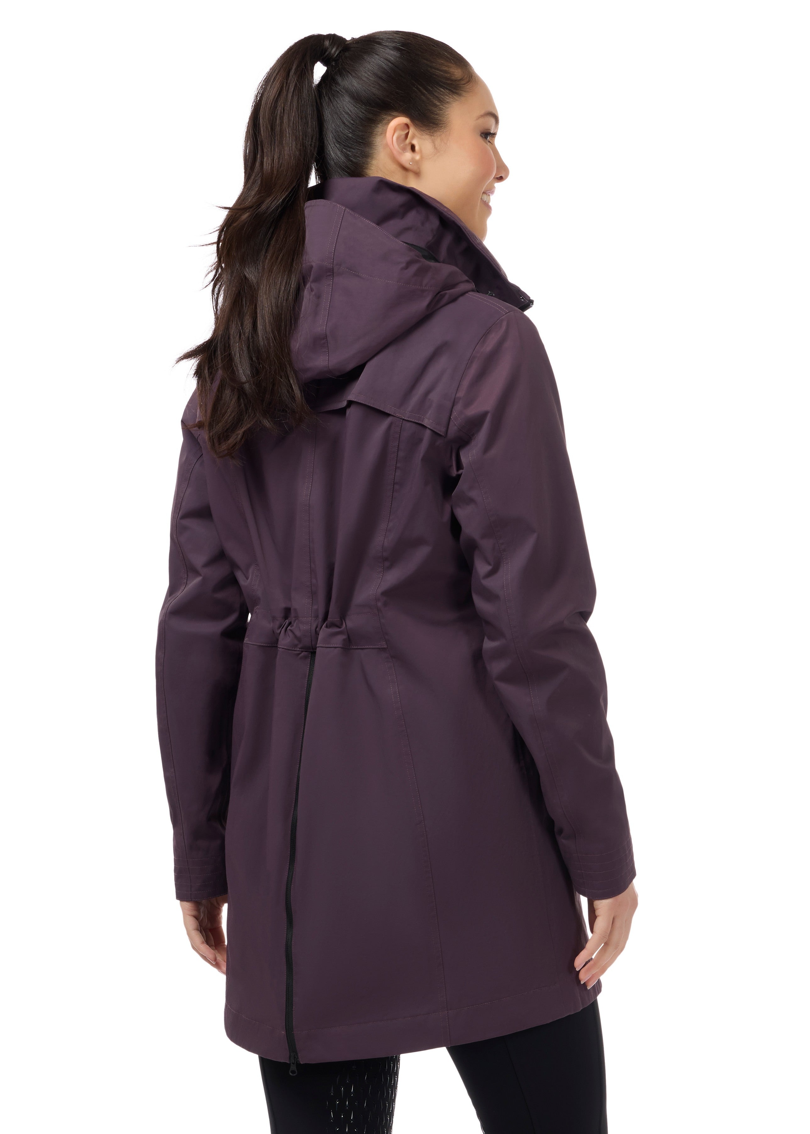 Angled back view of a model wearing Elderberry Kerrits Weatherlock Three-Quarter Length Jacket on white background