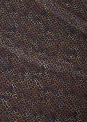Close-up of brown patterned fabric on riding shirt