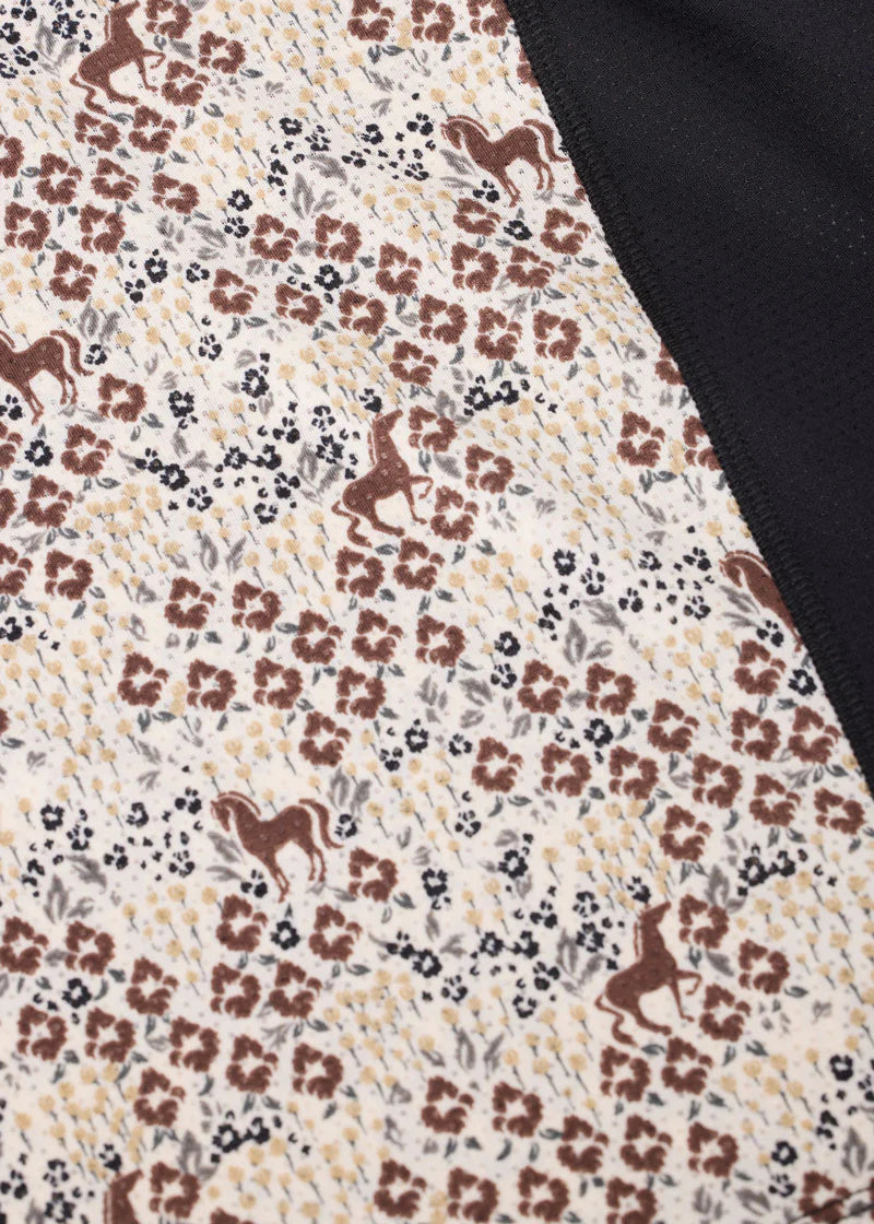 Close-up of equestrian print fabric on riding shirt