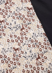 Close-up of equestrian print fabric on riding shirt