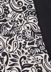 Close-up of black and white patterned fabric on riding shirt