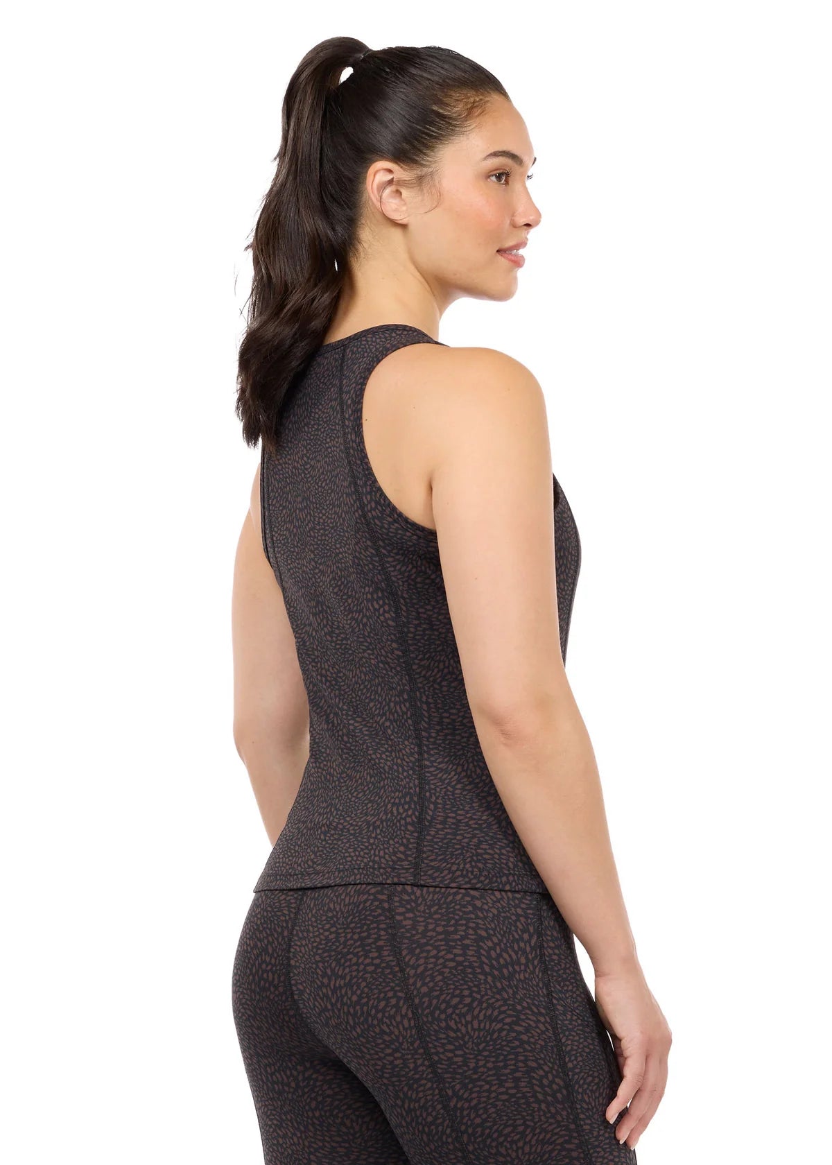 Woman wearing Kerrits Printed Sport Tank in Mocha brown, back view on white background