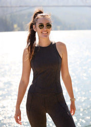 Woman wearing Kerrits Printed Sport Tank in Mocha brown outdoors near water