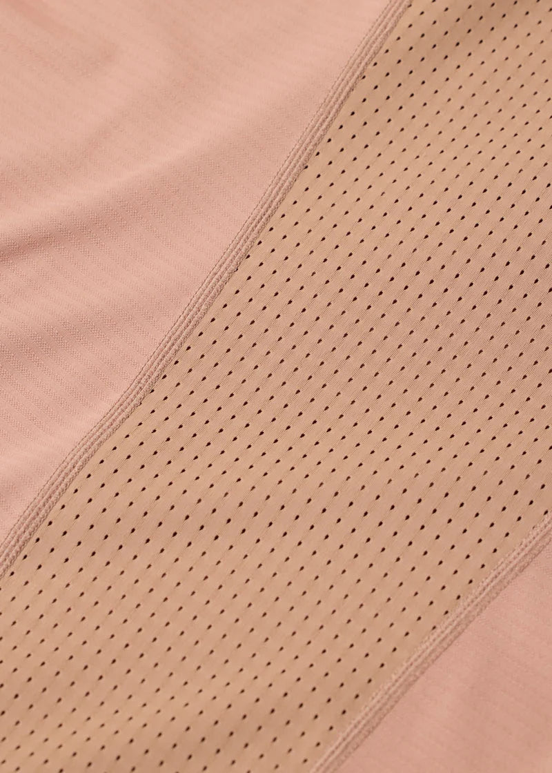 Close-up of perforated fabric on tan riding top