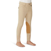 Side view of a model wearing the tan Ovation Boys Classic 4-Pocket Suede Knee Patch Breech on a white background