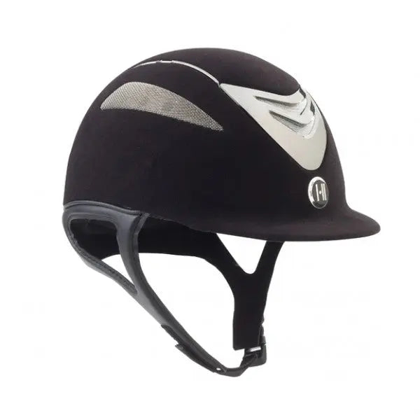 Angled front view of the black matte chrome stripe One K Defender Suede Helmet on a white background