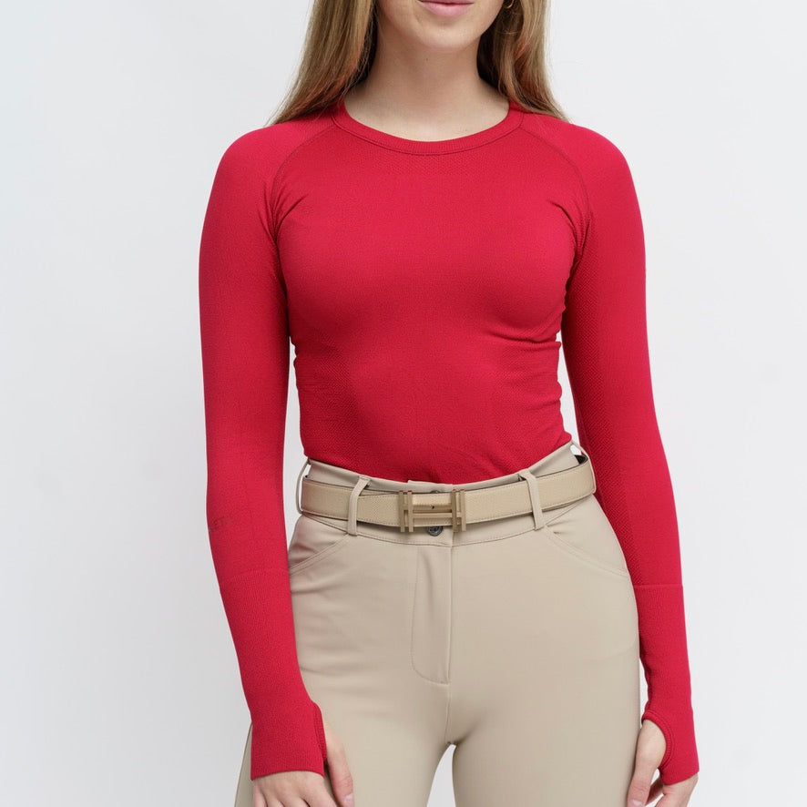 Front view of a female model wearing the Sour Cherry TKEQ Kennedy Seamless Long Sleeve Shirt 2.0 on a white background