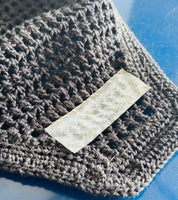 An AJ Equestrian Bonnet Bond Securing Strip on the underside of a brown ear bonnet