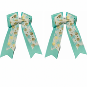 View of the Pineapple Belle & Bow Kids Hair Bows on a white background