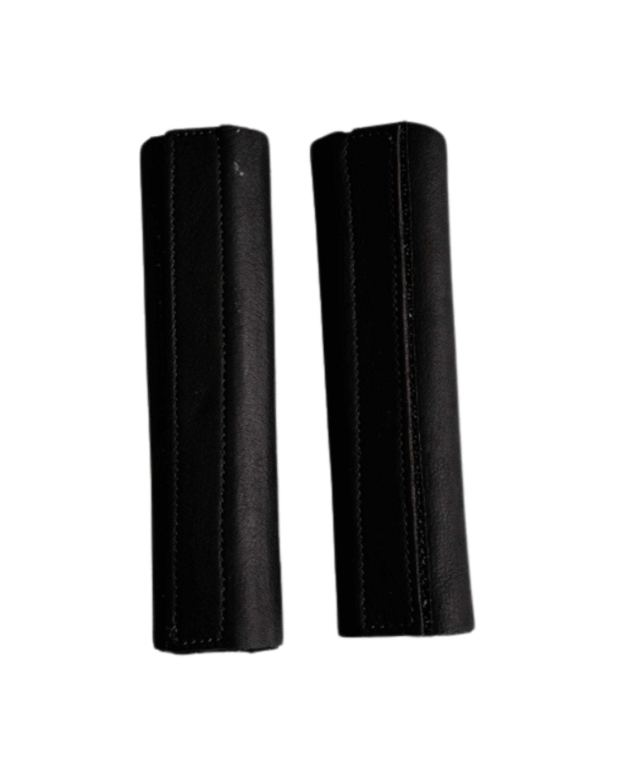 View of a pair of black DziaSport Eyes Forward Removable Leather Blinkers on a white background