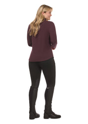 Back view of a model wearing Black Kerrits Fleece Lite II Knee Patch Tight on white background