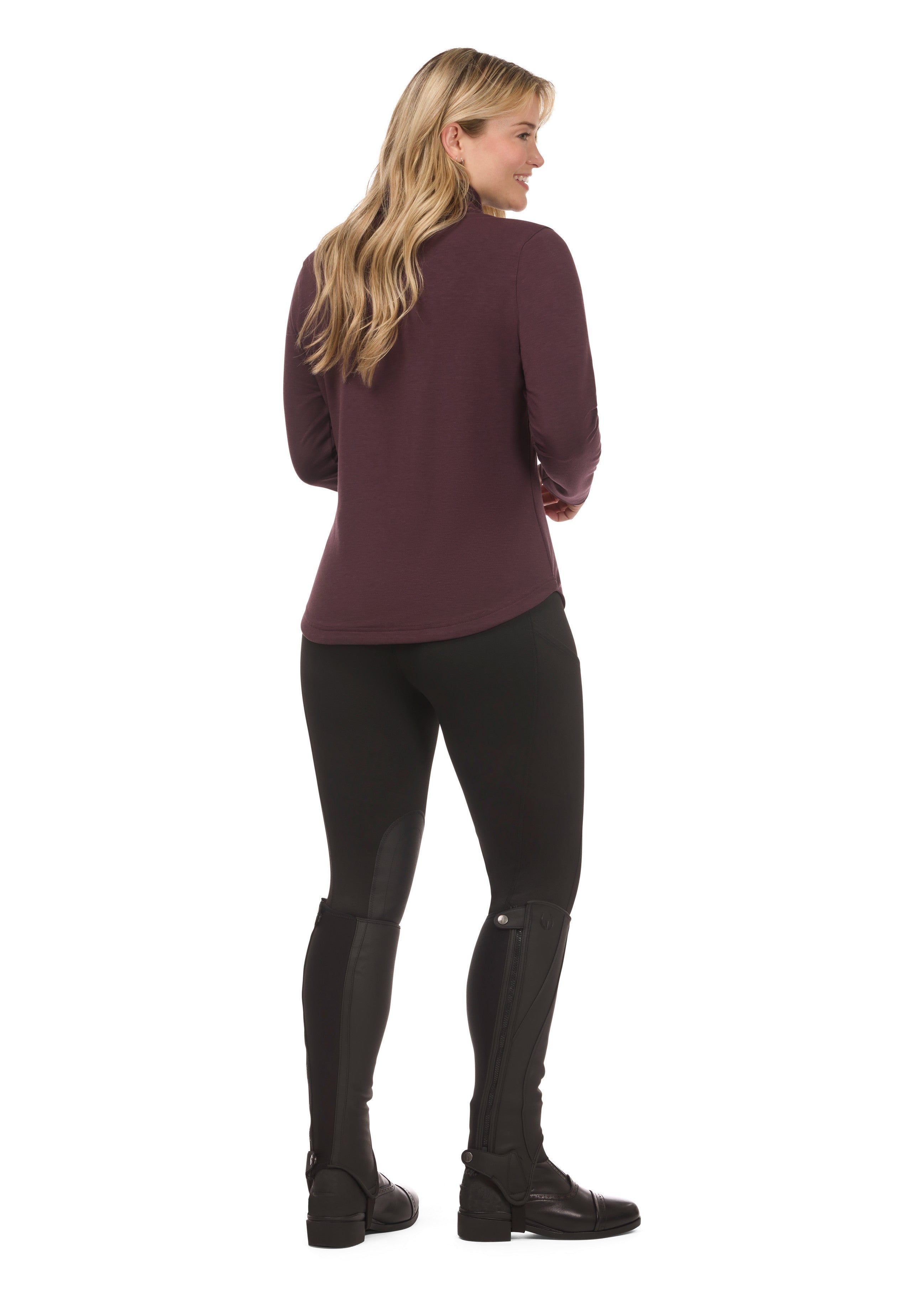 Back view of a model wearing Black Kerrits Fleece Lite II Knee Patch Tight on white background