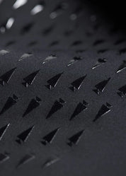 Close-up view of the fabric on the black Kerrits Kids Coolcore Full Seat Tech Tights