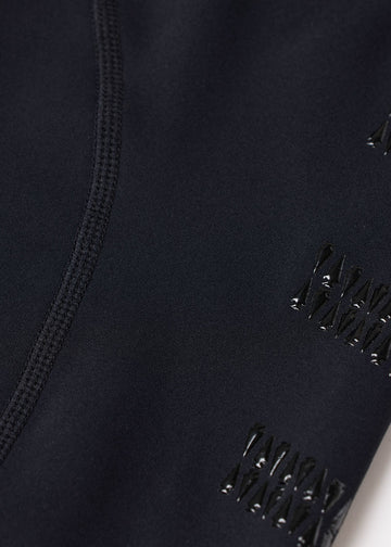 Close-up of black fabric showing knee patch grip detail