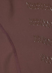 Close-up of brown fabric showing knee patch grip detail