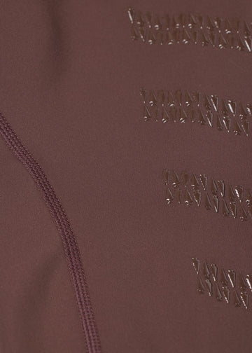 Close-up of brown fabric showing knee patch grip detail
