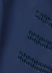 Close-up of blue fabric showing knee patch grip detail