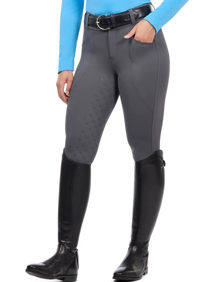 Person wearing gray full seat breeches with tall black boots, front view