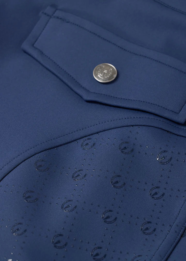 Close-up of blue breeches showing full seat grip pattern and pocket