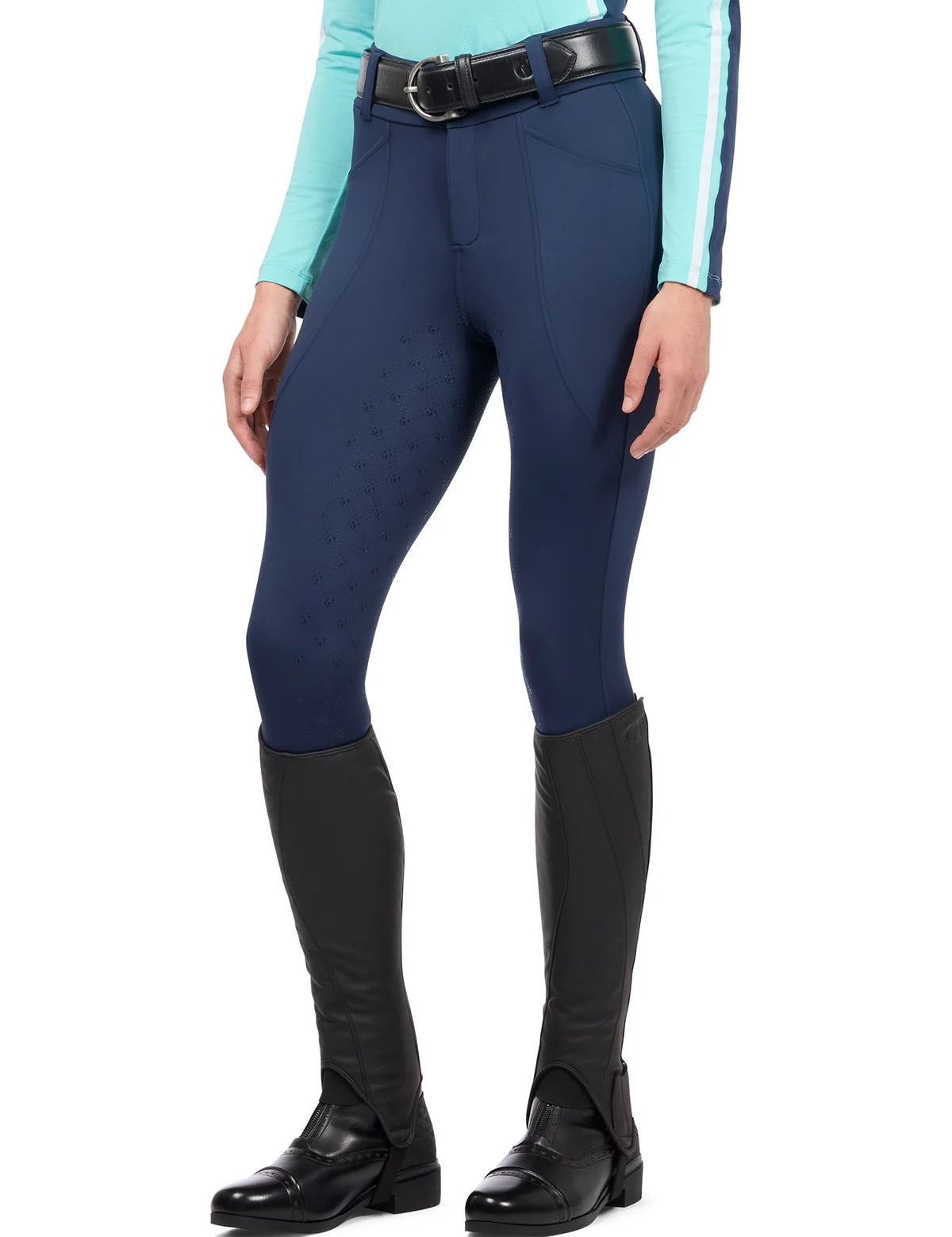 Front view of a model wearing the blue Kerrits Free Motion Coolcore Full Seat Breech on a white background