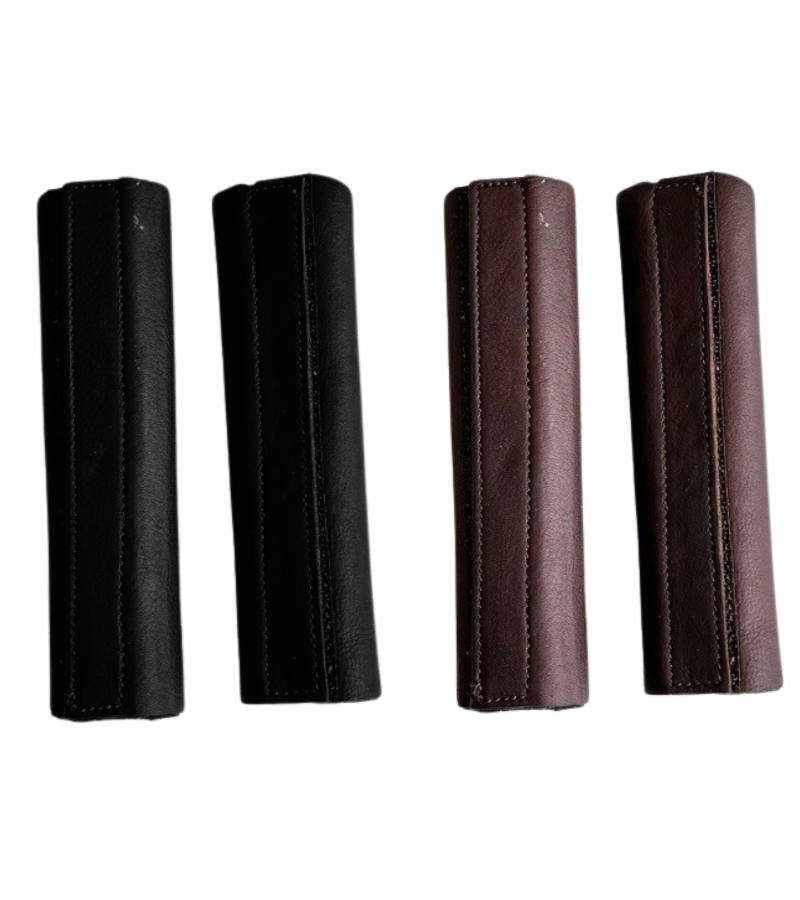 View of a pair of black and a pair of brown DziaSport Eyes Forward Removable Leather Blinkers on a white background