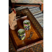 View of the riding boot Blue Stallion Farm Zinc Bottle Opener on a wooden tray with drinkware
