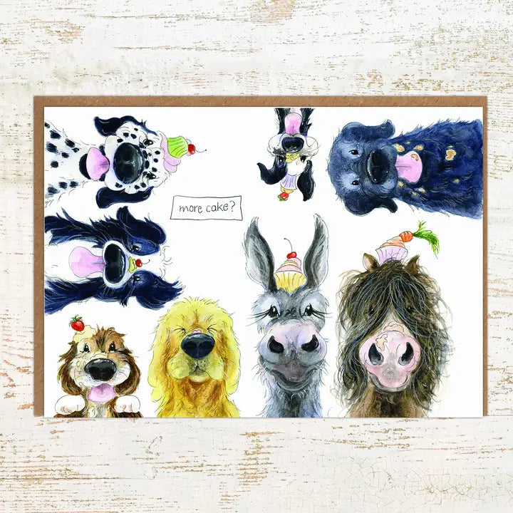 View of the More Cake Menagerie Pony Nut Greeting Card on a white washed wood background
