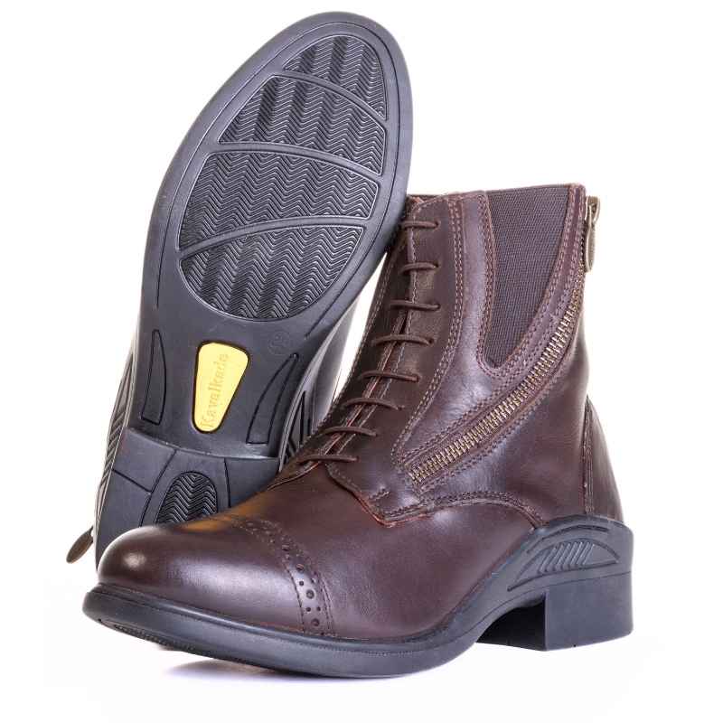 Side-by side bottom and side views of the brown Kavalkade Romulus Oiled Leather Side Zip Paddock Boots on a white background