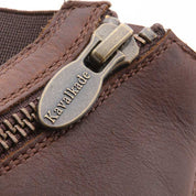 Close-up view of the zipper on a brown Kavalkade Romulus Oiled Leather Side Zip Paddock Boot