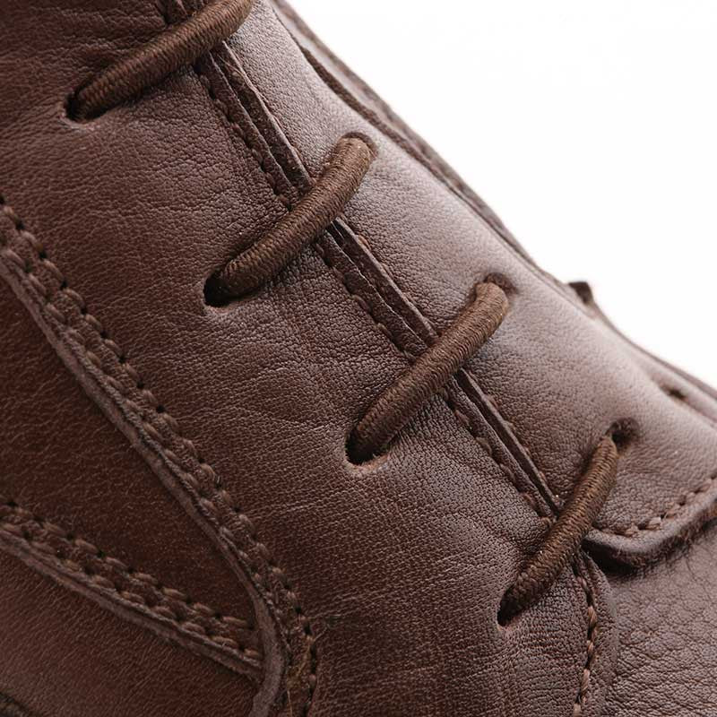 Close-up view of the decorative laces on a brown Kavalkade Romulus Oiled Leather Side Zip Paddock Boot