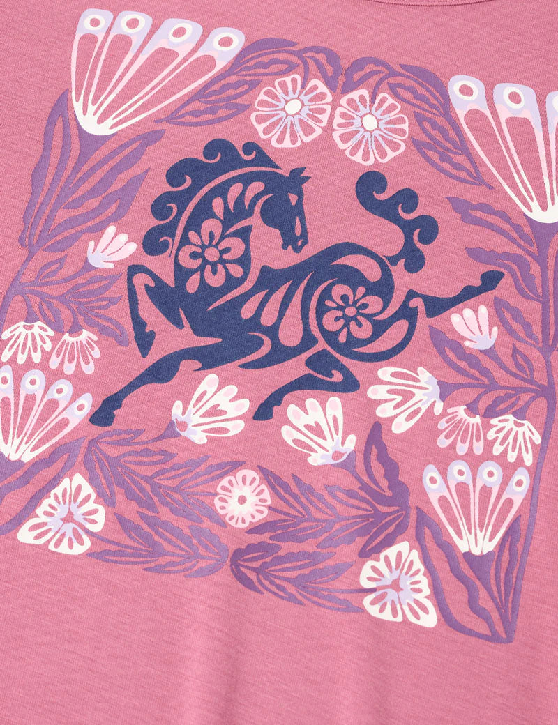Close-up view of the "Frolic Horse" design on the pink Kerrits Kids Frolic Horse Tee