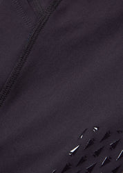 Close-up view of the fabric on the purple Kerrits Kids Thermo Tech Full Leg Tight