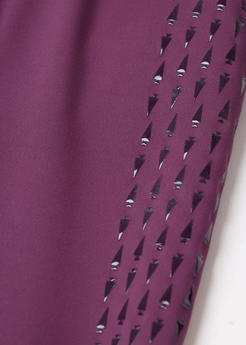 Close-up view of the fabric on the purple Kerrits Kids Coolcore Full Seat Tech Tights