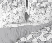 Close-up view of the AWST Int'l "Lila" Elegant Horse Sheet Set displayed on a bed