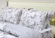 View of the AWST Int'l "Lila" Elegant Horse Sheet Set displayed on a bed