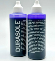 Side-by-side front and back views of Durasole Hoof Toughener on a gray background