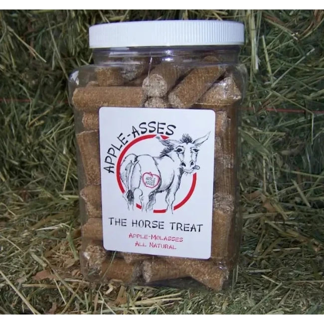 View of a 3 lb jar of Apple-Asses The Horse Treat with hay in the background