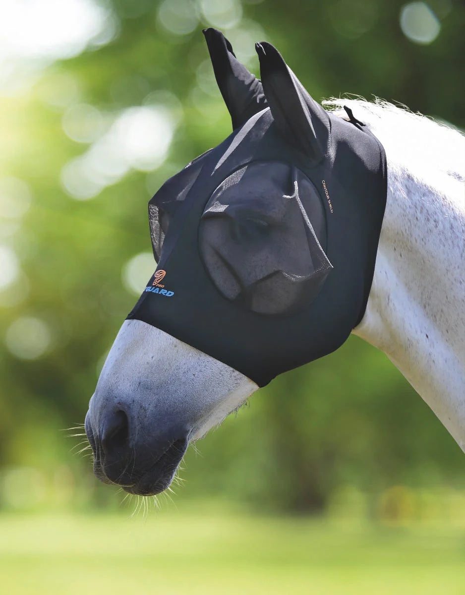 Side view of a gray horse standing outside wearing the Shires FlyGuard Pro Stretch Fly Mask in black 