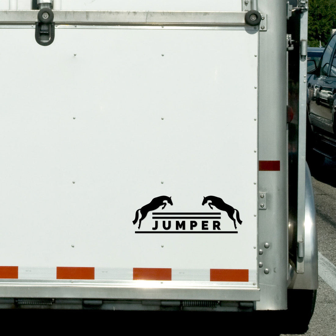 View of the black jumper Dapplebay Vinyl Decal on the back of a horse trailer
