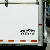View of the black dressage Dapplebay Vinyl Decal on the back of a horse trailer
