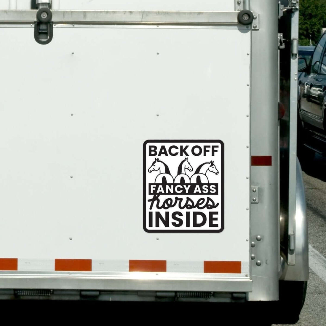 View of the Fancy A$$ Horses Dapplebay Vinyl Trailer Decal on the back of a horse trailer